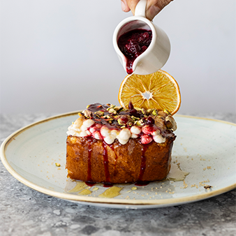 Caramelised brioche with a crispt Brûlée crust, topped with a whipped anari cream infused with orange zest, drizzled with raw Cyprus honey, roasted pistachios and served with a seasonal berry compote.