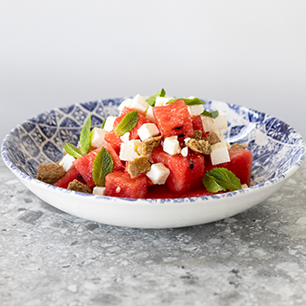 Fresh watermelon bites, Greek feta, fresh mint, crunchy barley rusks, lime juice, cold-pressed extra virgin olive oil